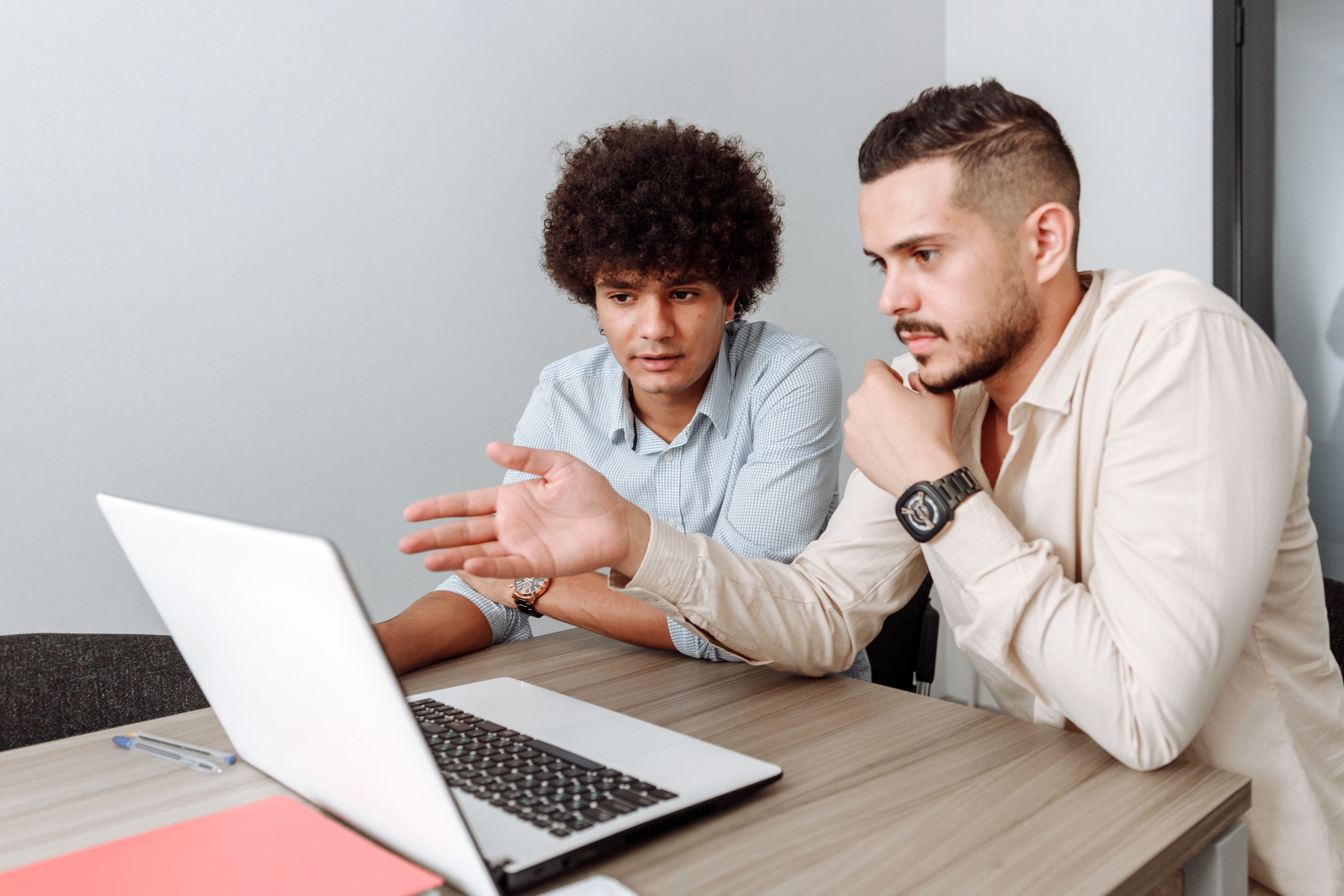 Admins managing the rewards catalog on a laptop
